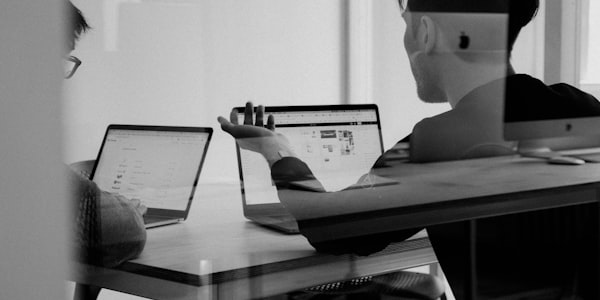 Professional technology consulting team collaborating on digital strategy